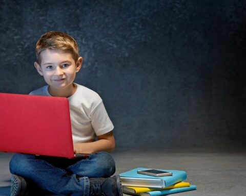 boy with a red laptop