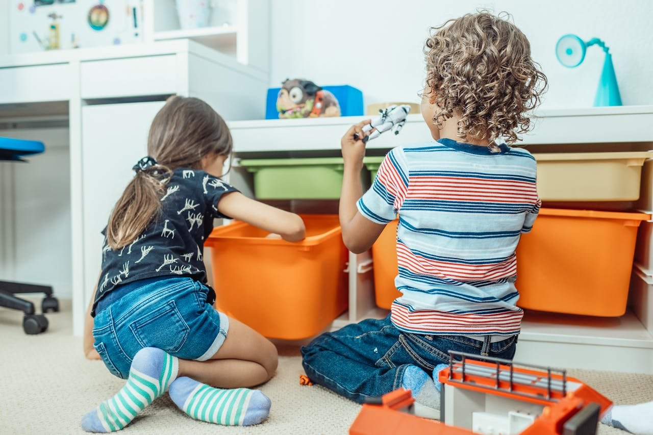 kids playing with toys in a new room 